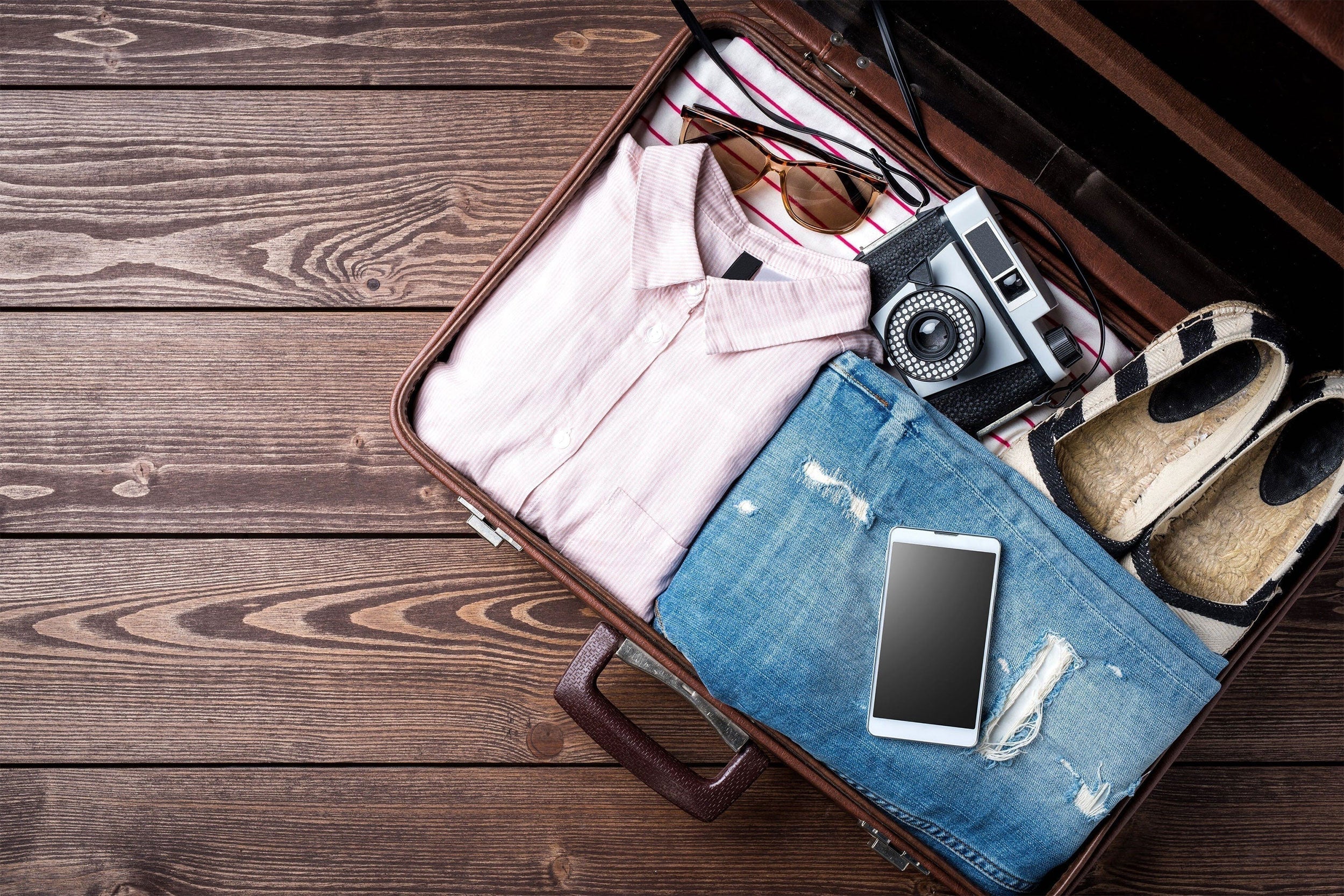 items packed in a suitcase on the floor