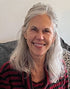 woman sitting and smiling at the camera