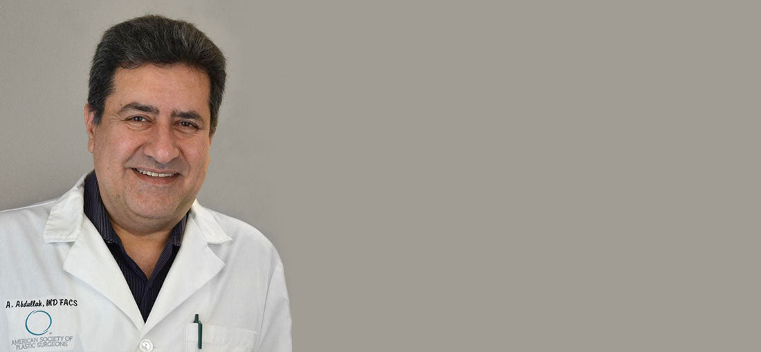 Dr. Ahmed Abdullah smiling on a beige background