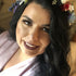 woman smiling and looking up at the camera
