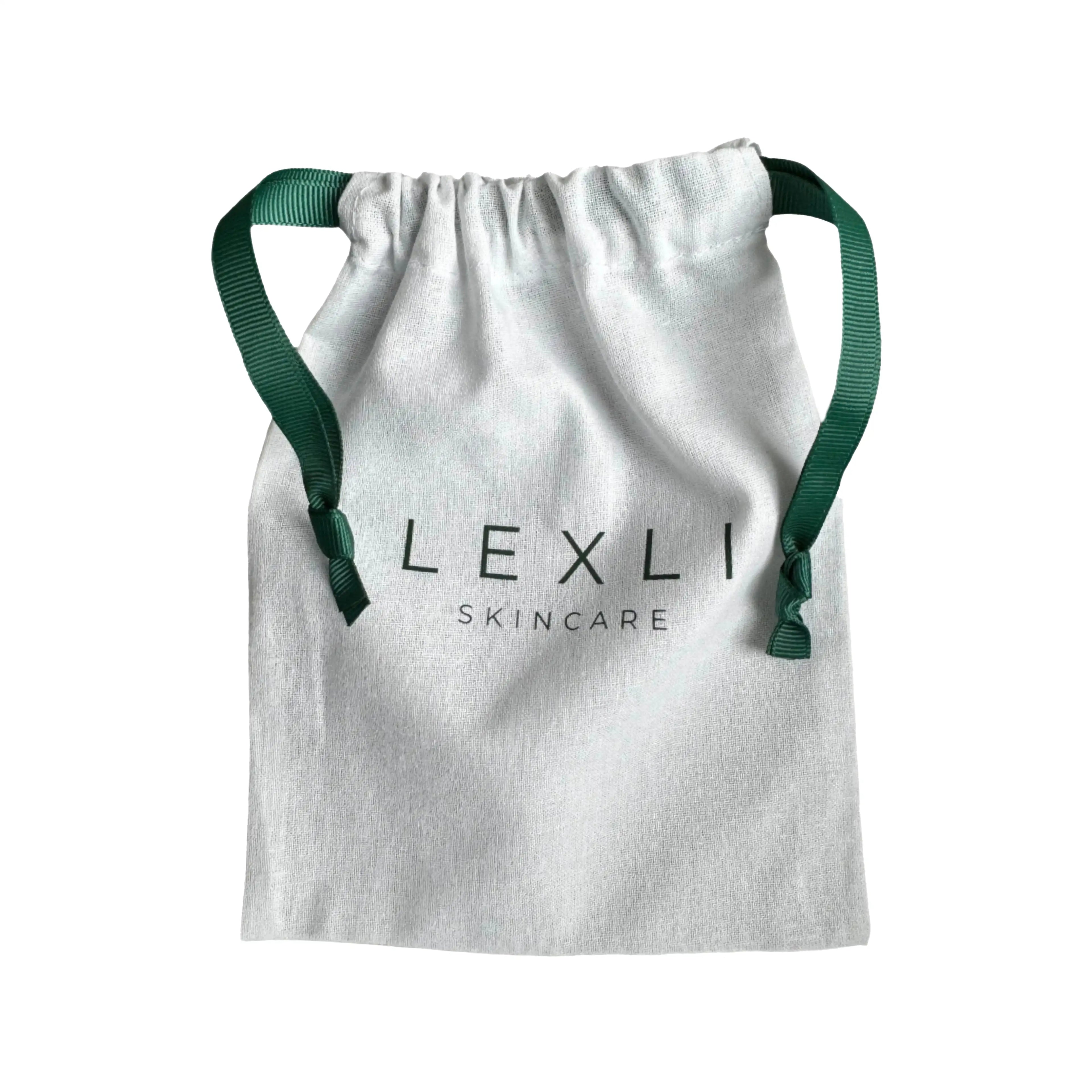 white cloth bag with Lexli logo and green ribbon drawstrings