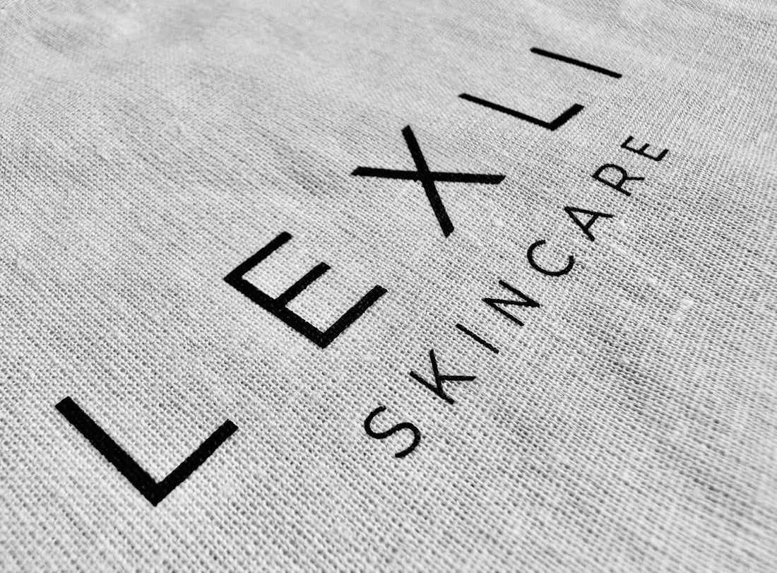 close-up of white knit cloth with Lexli Skincare logo