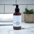 4 oz Ultimate Hand & Body Cream on a bathroom countertop